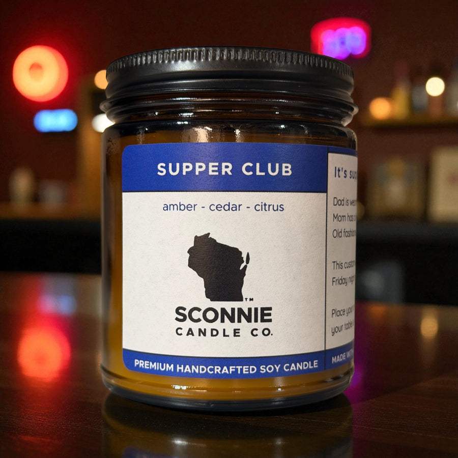 Supper Club candle on display. Amber and mandarin scent. 